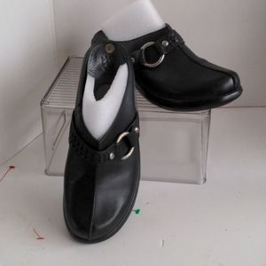 Black leather clogs